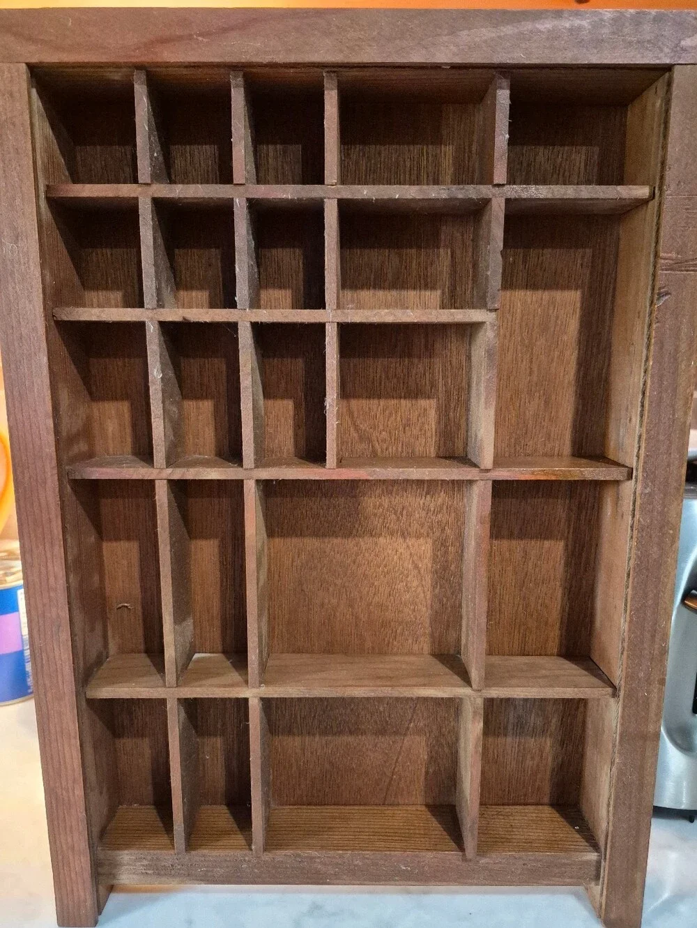 Vintage wooden shadow box features 22 unevenly sized compartments